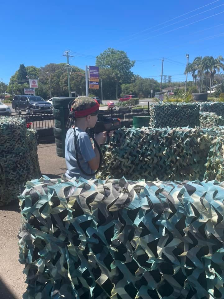 Woman Holding a Laser Gun — Things to Do in Port Macquarie, NSW