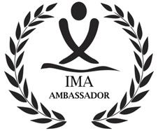 The ima ambassador logo is a black and white logo with a laurel wreath around it.