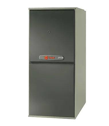 Dark gray furnace with beige side panel, orange Trane logo.