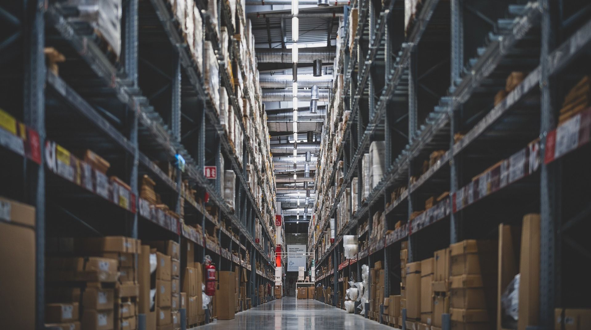 A warehouse filled with lots of boxes and shelves.