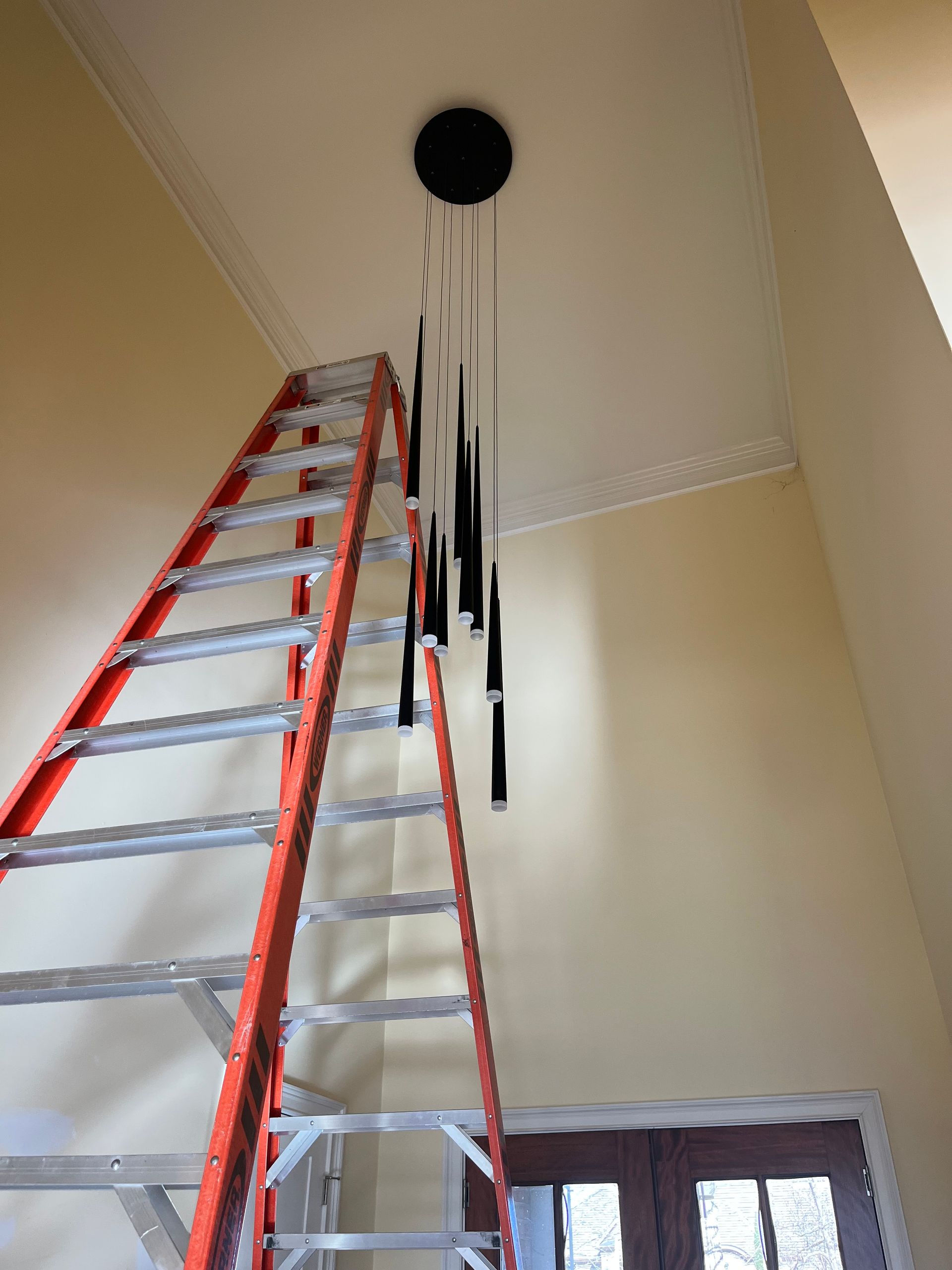 a ladder is hanging from the ceiling in a room