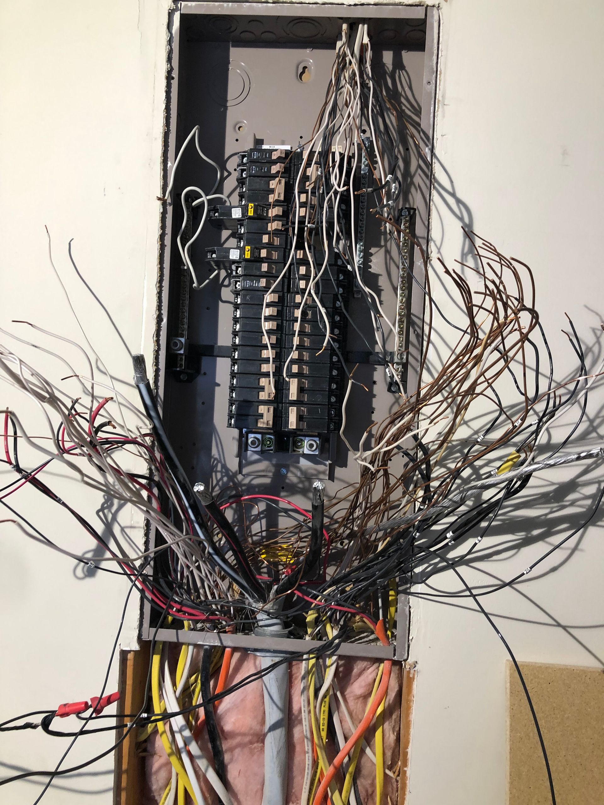 a bunch of wires are hanging from a electrical box