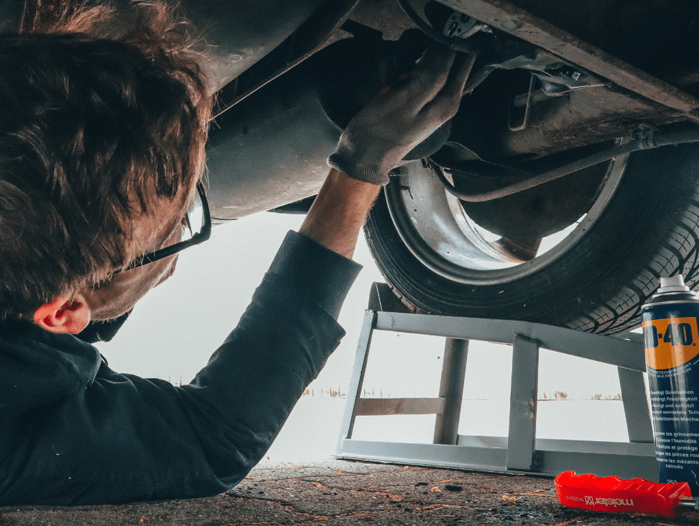 Mobile Mechanic under a vehicle in Huntsville AL