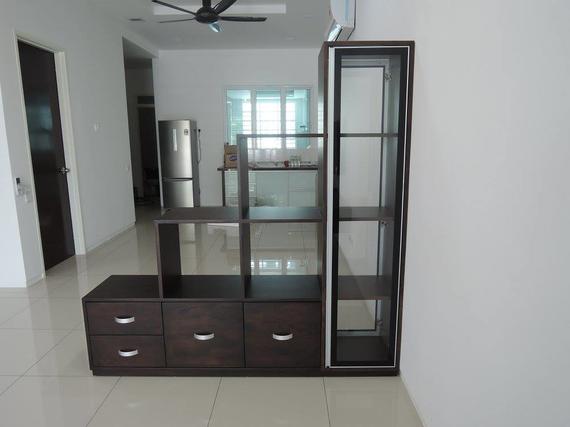 Dark brown storage unit with drawers and shelves, against a white wall in a room.