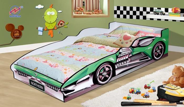 Green car-shaped children's bed with floral bedding, decorated room with a cartoon, toys, and a teddy bear.