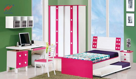 Girl's bedroom with pink and white furniture: bed, desk, wardrobe, and shelves. Green wall, blue sky view.