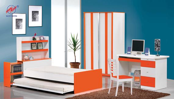 Modern orange and white bedroom set: bed with pull-out, desk, wardrobe, shelving, chair, and computer in a blue room.