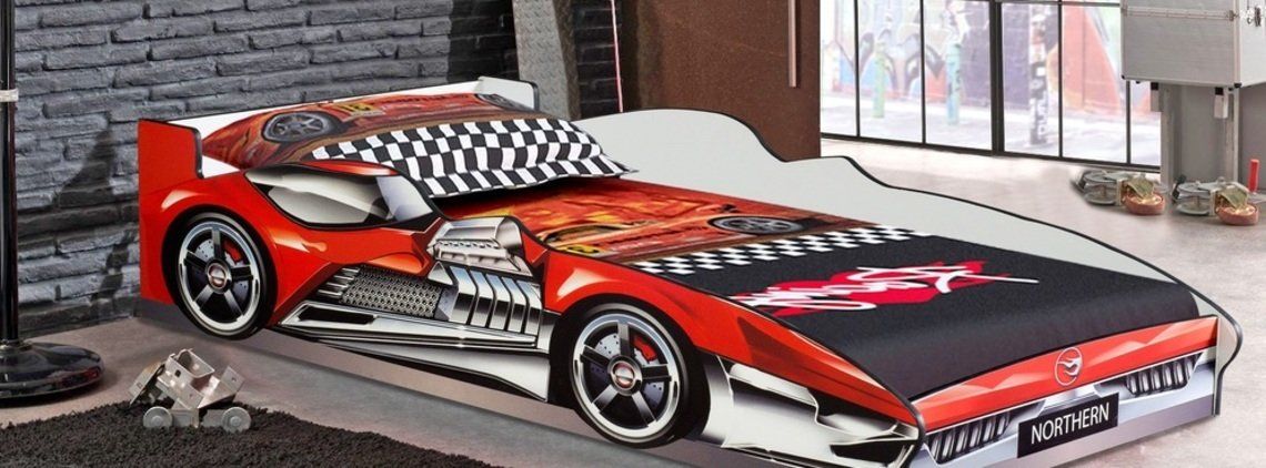 A red and black race car-shaped bed in a child's bedroom.