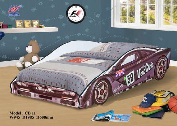 Race car bed in a child's room; purple with number 59. Teddy bear, books, and clock are also visible.