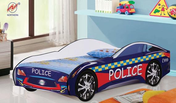 Police car-shaped bed in a child's room. Blue, red, and white colors. Wheels and 