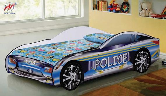 Child's bed shaped like a blue and white police car, in a bedroom setting.