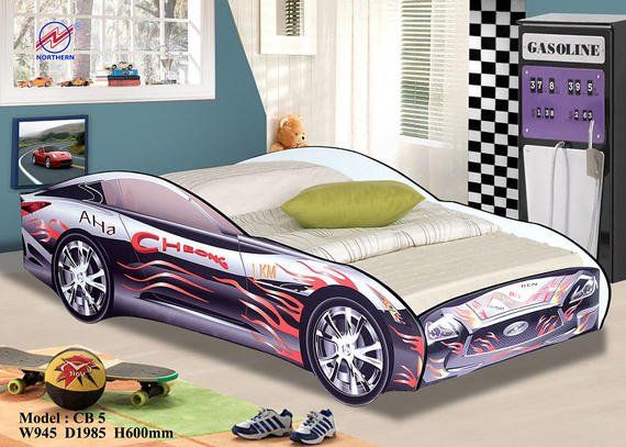 Race car bed in a child's room with decorative elements like a gas pump, skateboard, and small cars on a shelf.
