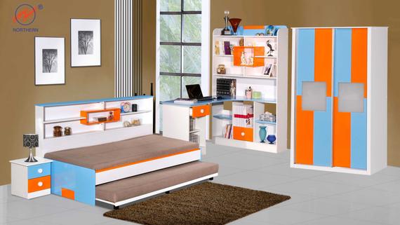 A colorful kids bedroom set: bed, nightstand, desk, shelves, and wardrobe with blue and orange stripes.