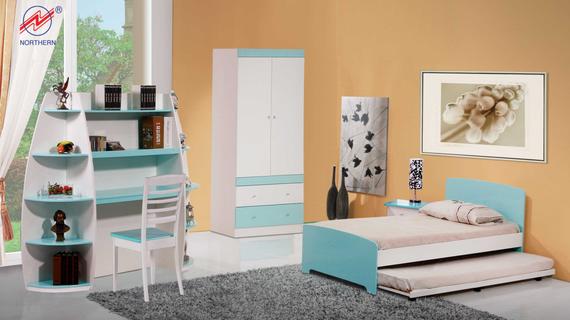 A child's bedroom with white and blue furniture, including a bed, desk, wardrobe, and bookshelves, set against a yellow wall.