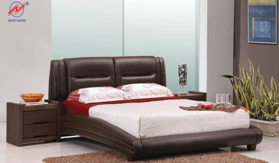 Brown leather bed with matching nightstands in a modern bedroom.