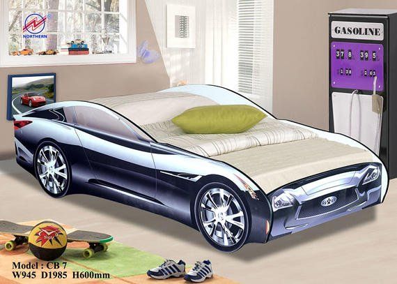 Car-shaped bed in a kid's room. The bed is black, chrome, and silver, with a green pillow. Skateboard and sneakers on the floor.