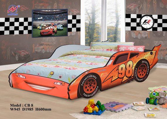 A child's bed shaped like Lightning McQueen from Cars, orange with the number 98.
