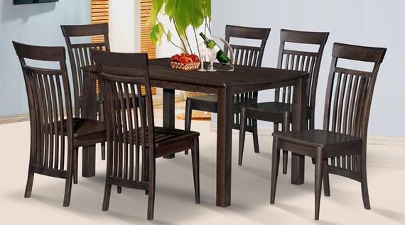 Dark wood dining table and six matching chairs, set indoors.