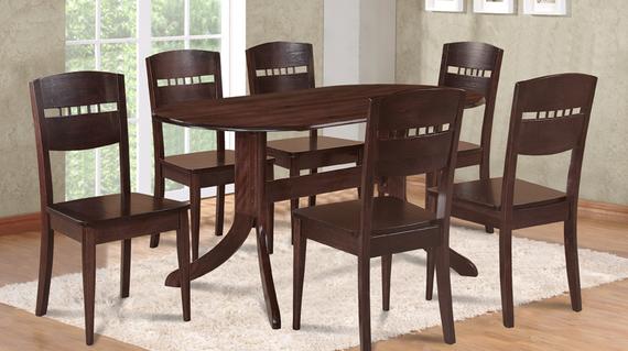 Dark wood dining table with six matching chairs on a white rug.