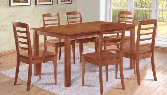 Wooden dining set with six chairs, on a white rug.