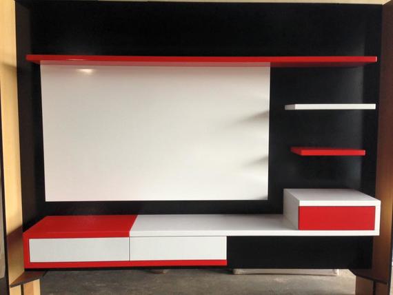 Modern black, white, and red media console with shelves and a drawer.