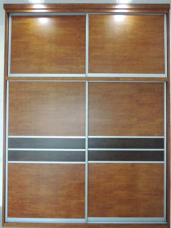 Wooden sliding door wardrobe with brown panels and a dark horizontal accent.