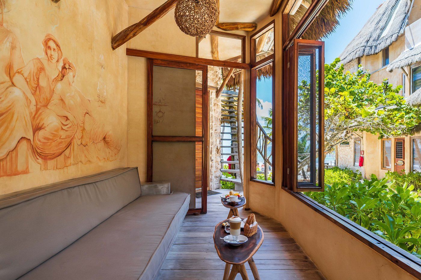 A bedroom with a sliding glass door leading to a balcony