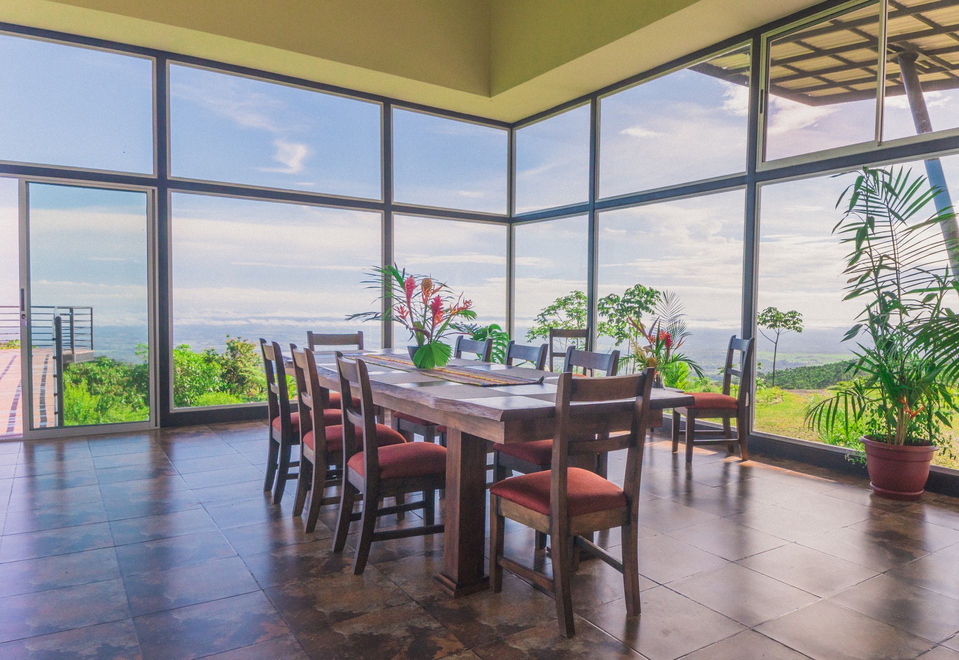 A group of people are sitting at a long table with plates of food