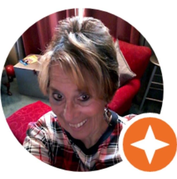 A woman in a plaid shirt is smiling in a circle with an orange star