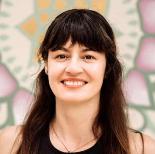 A woman is smiling for the camera.