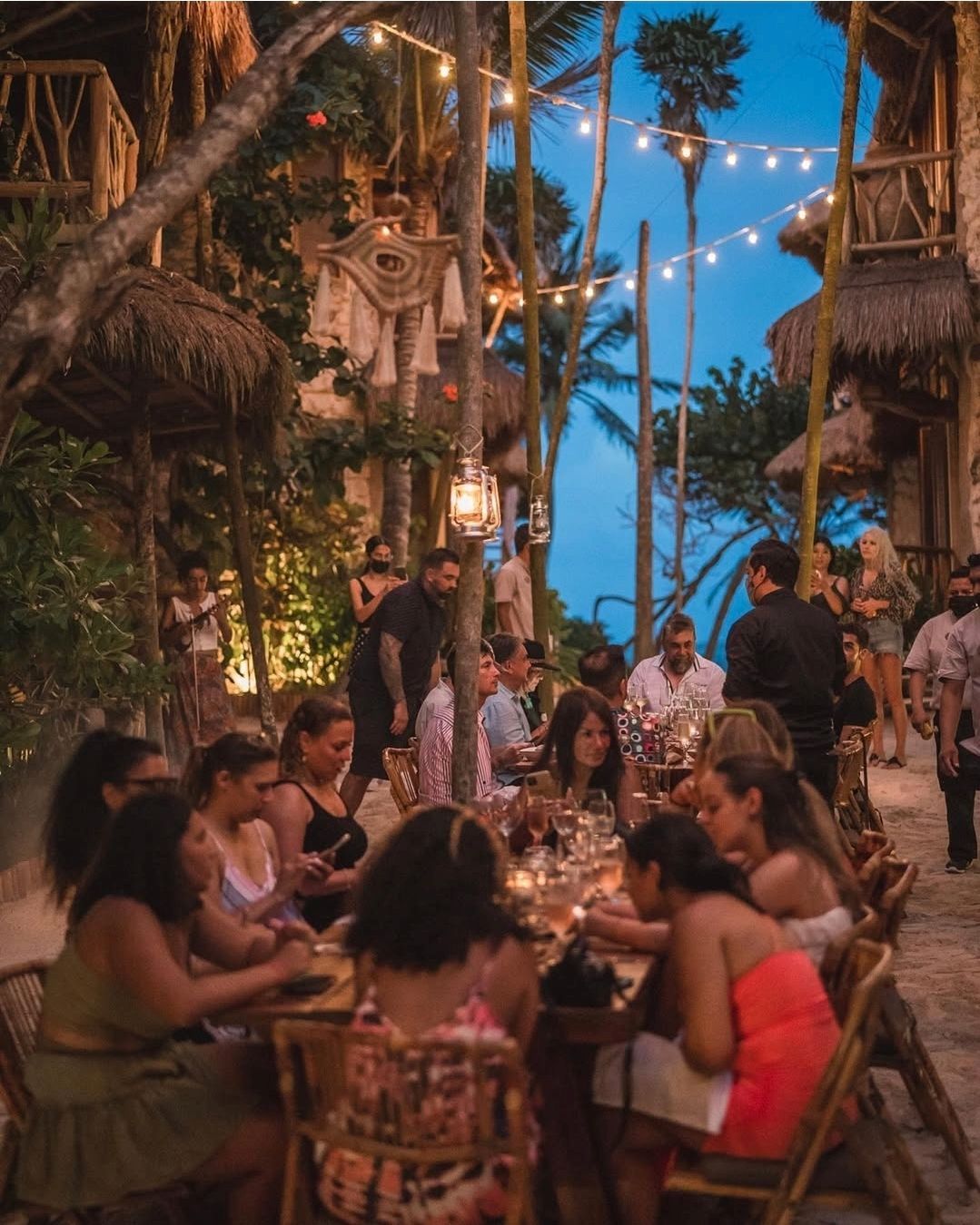 A bathroom with a large mirror and a sink.