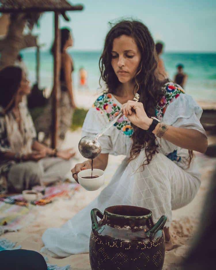 woman pouring cacao in bowl