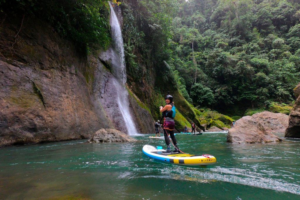 A long table with plates of food and drinks on it.