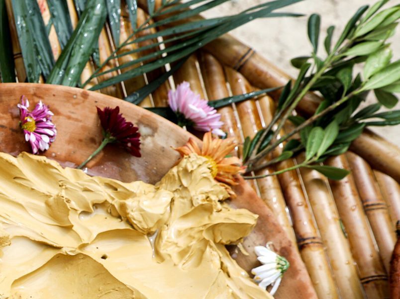 A long table with plates of food and drinks on it.