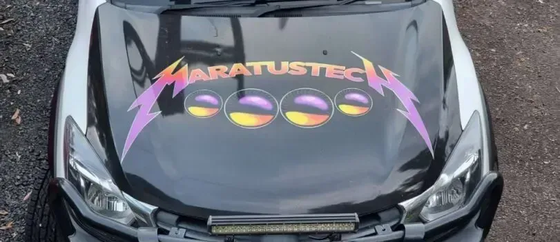 A Black Car With a Metallica Logo on the Hood — Maratustech In Woy Woy, NSW