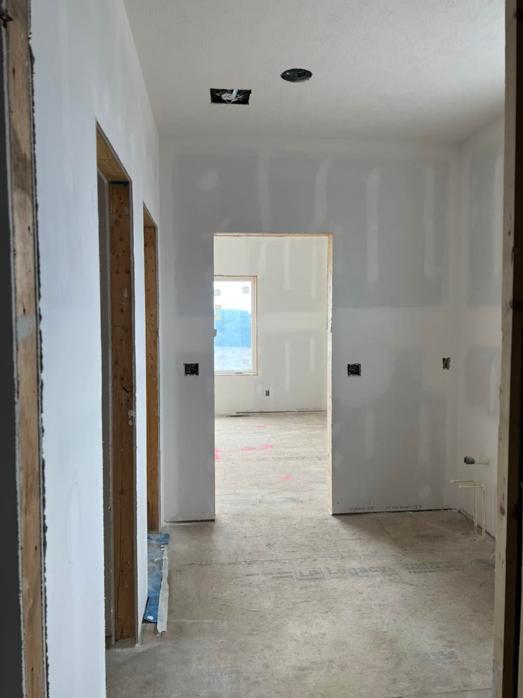 A hallway in a house that is being remodeled