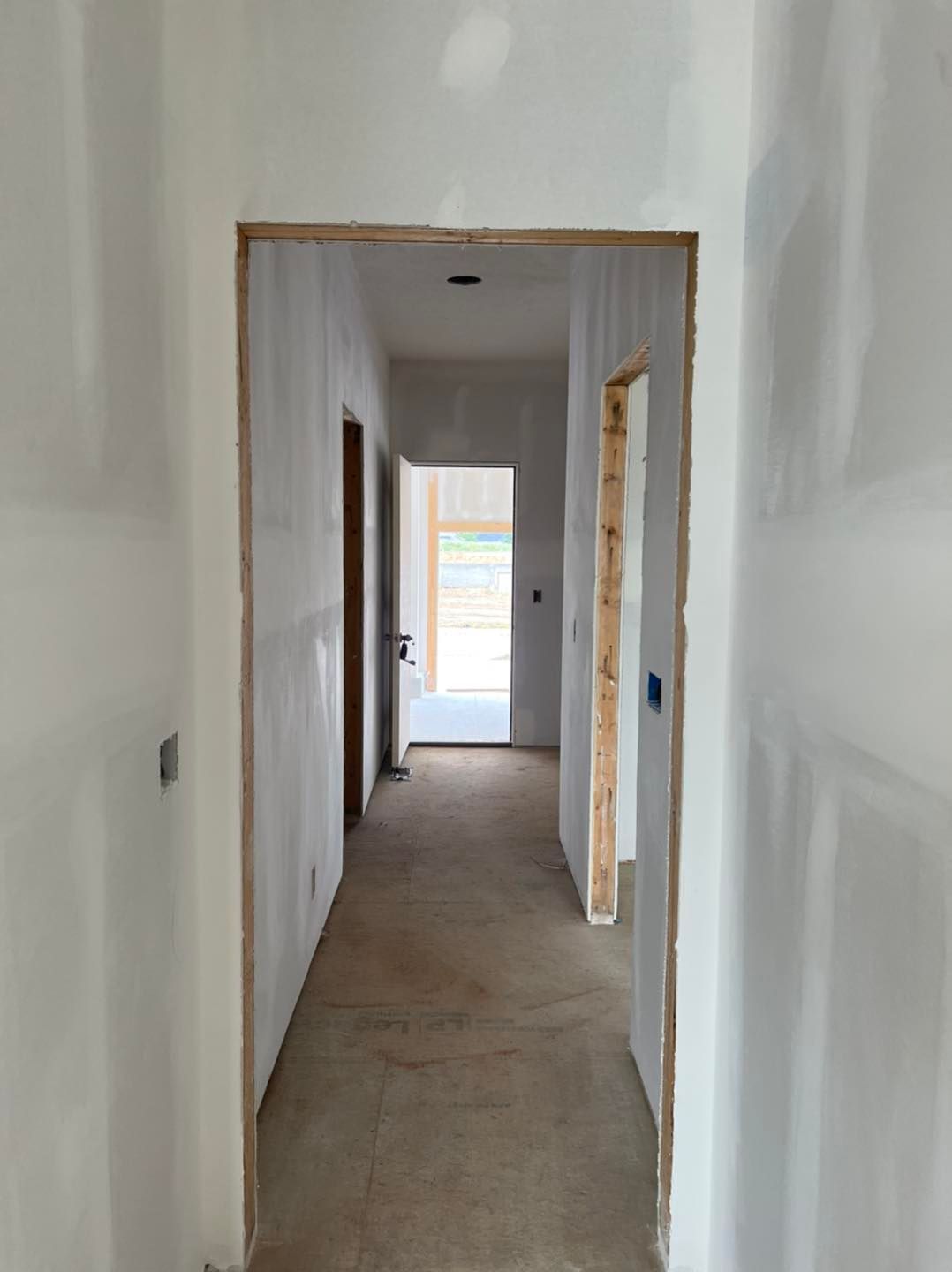 A hallway in a house that is being remodeled.