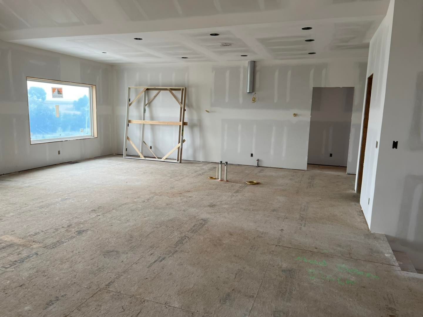 An empty room with a scaffolding in the middle of it