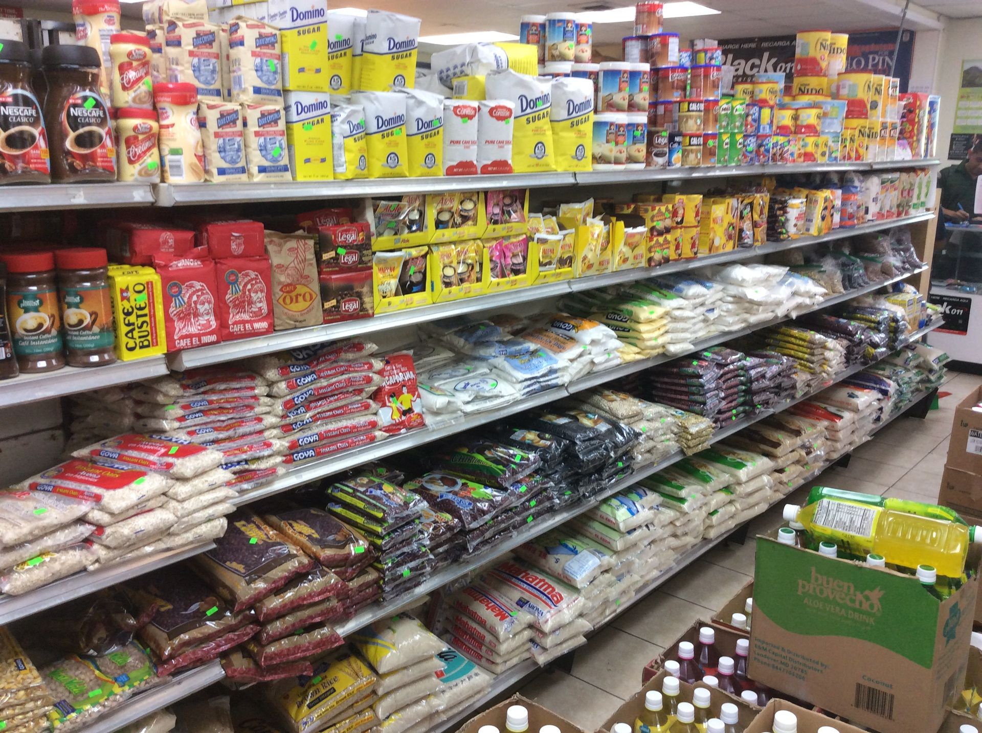 Shelves stocked with various packaged food items in a store.