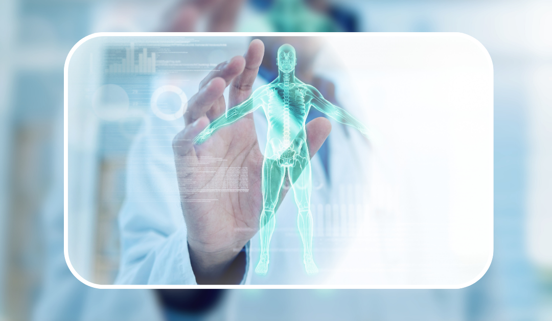 A doctor is holding a 3d model of a human body in his hand.