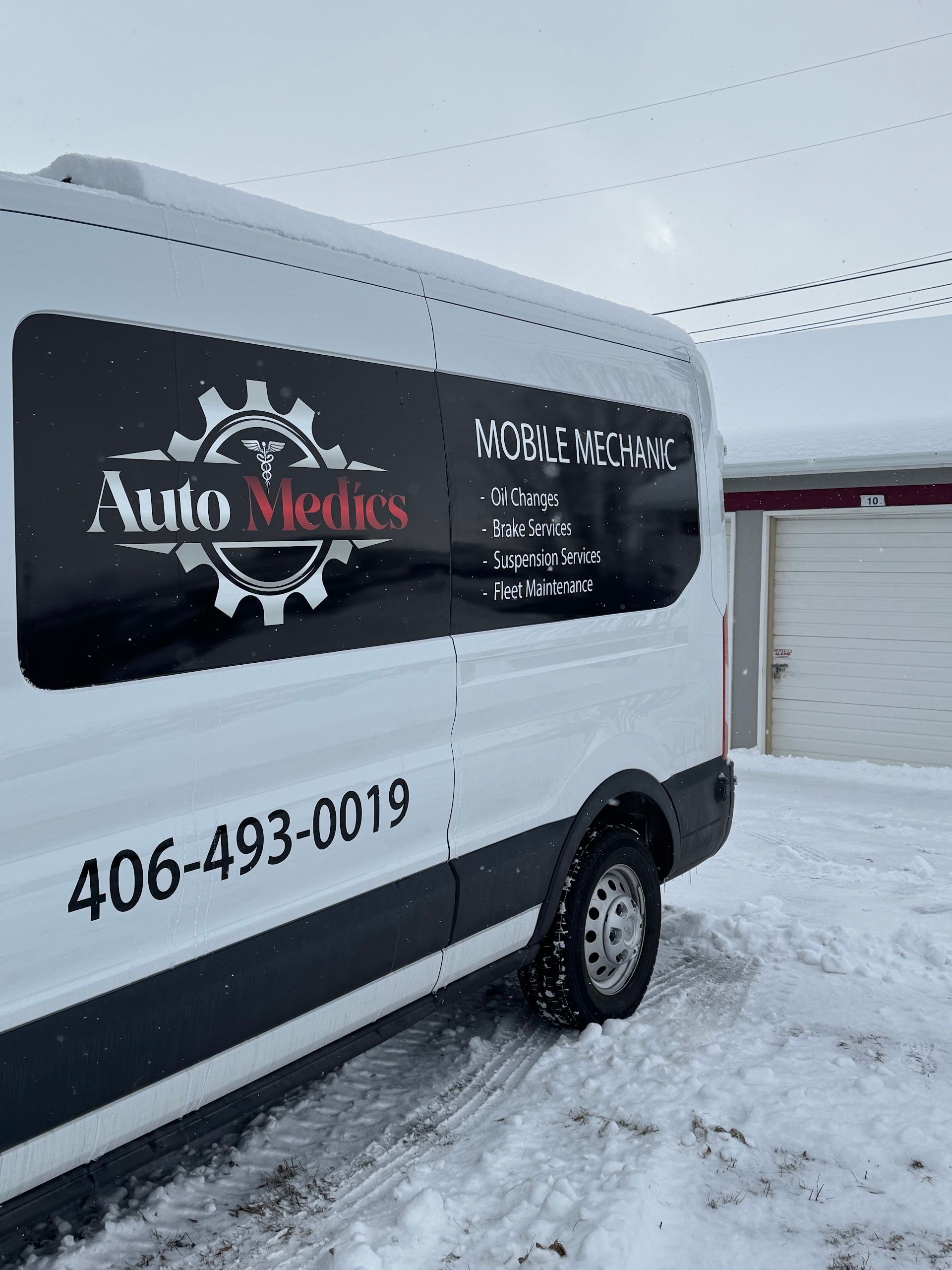 White Van with Shop Logo | Auto Medics