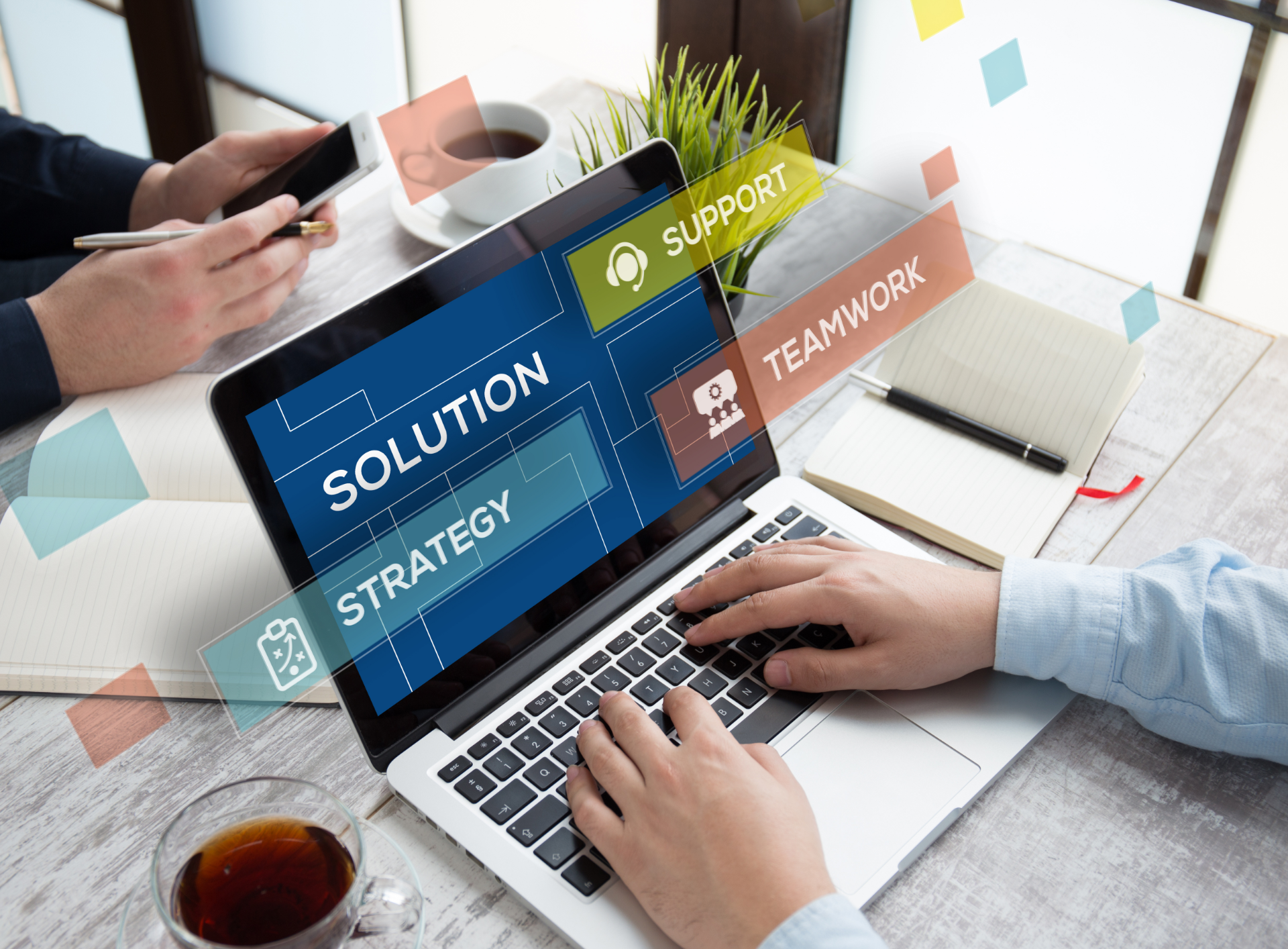 A person is typing on a laptop computer with the word solution on the screen.