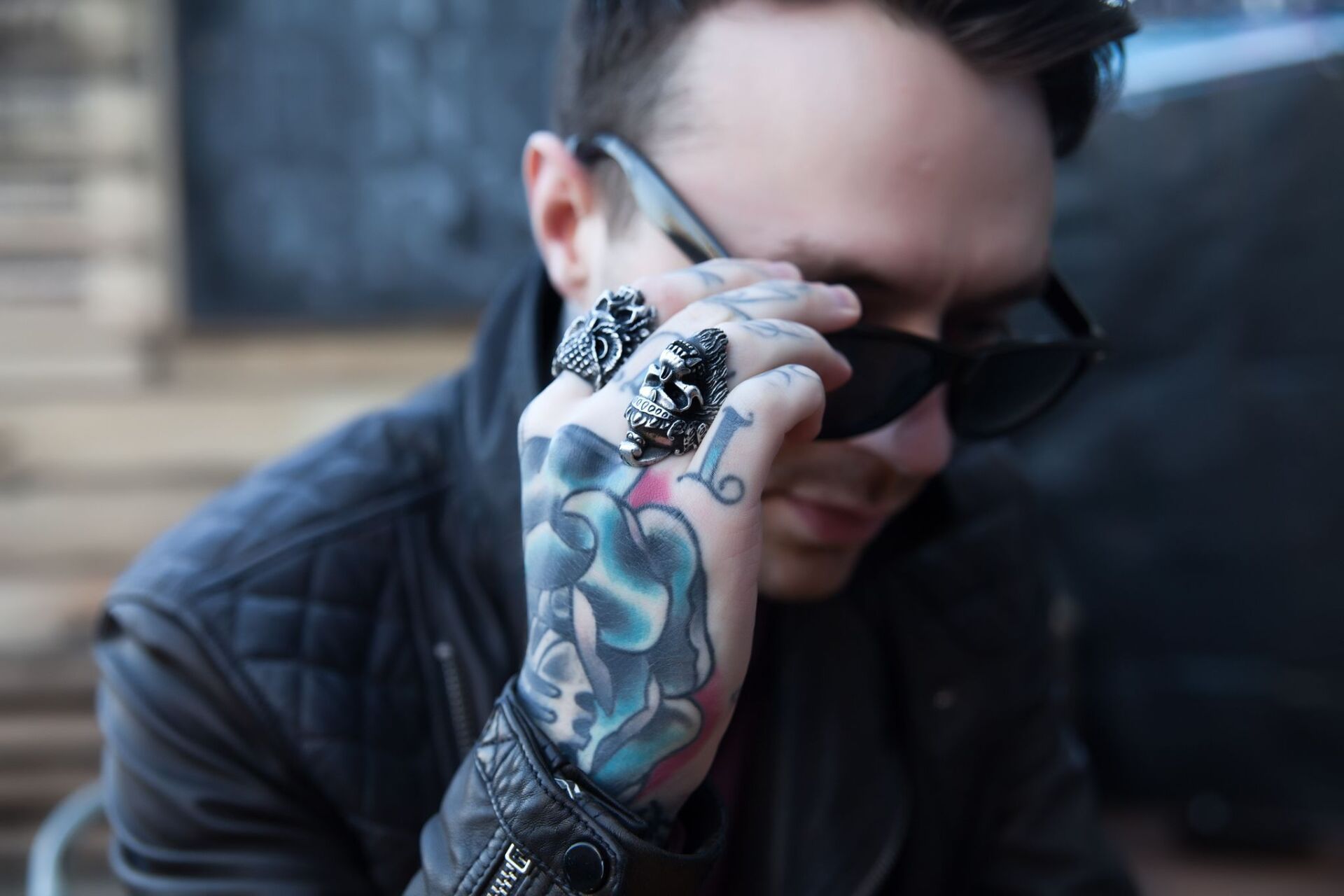 Man with eyeglass and tattoo