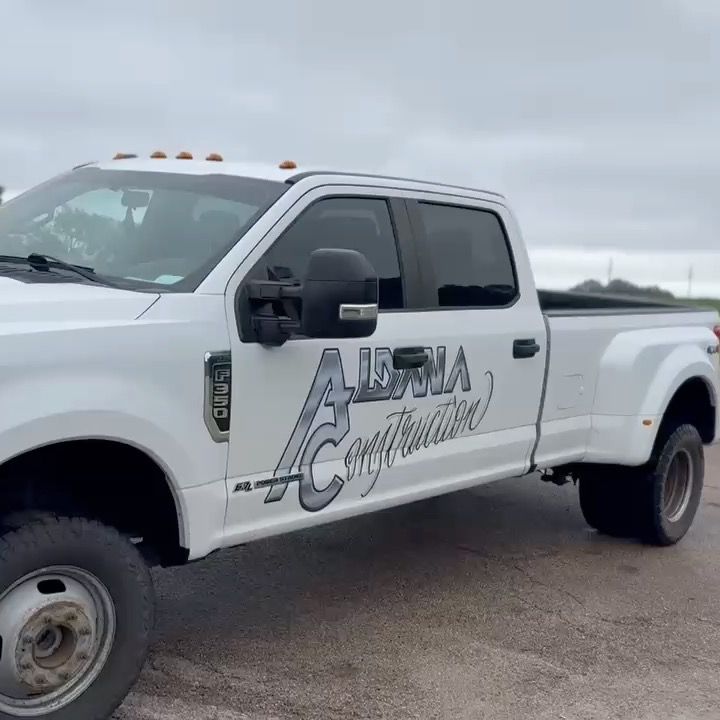 A white truck with the word alpha on the side