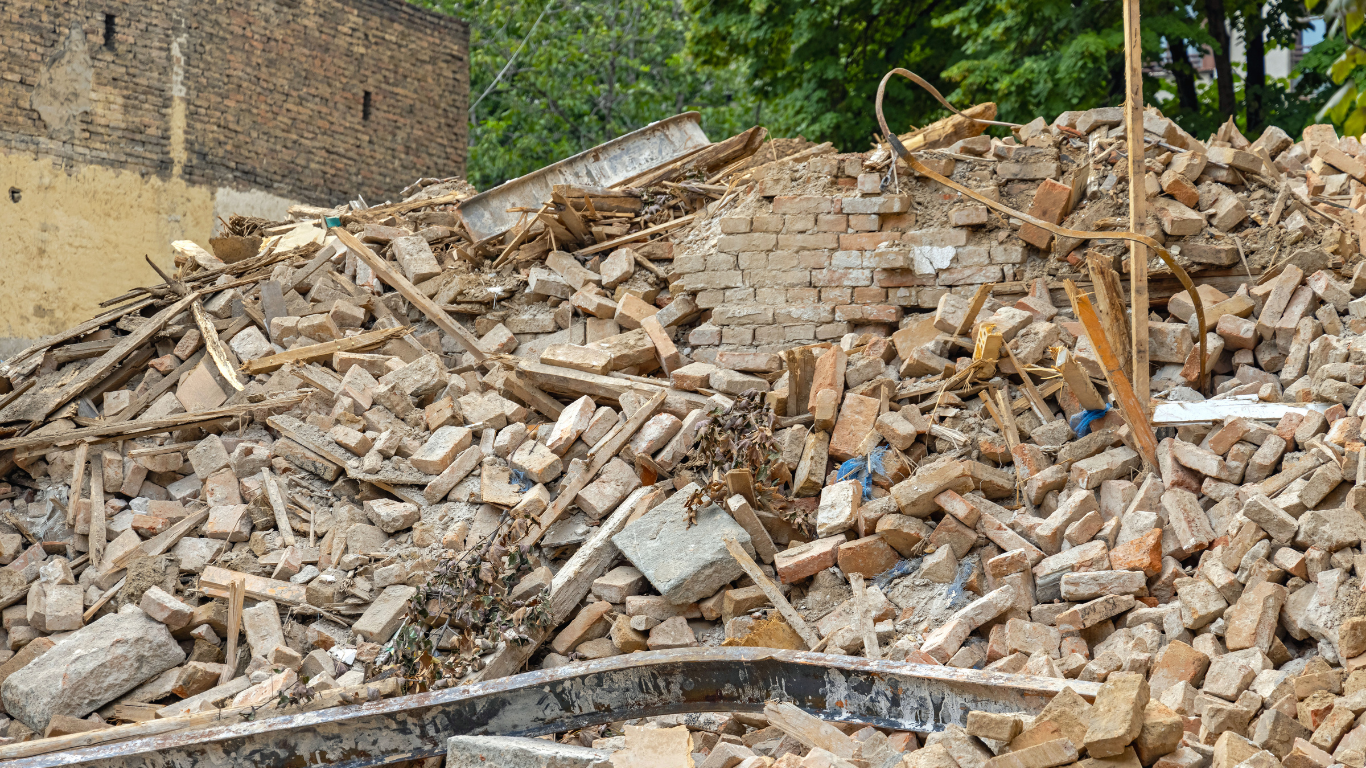 Pile of demolished bricks and debris, possibly from a building.