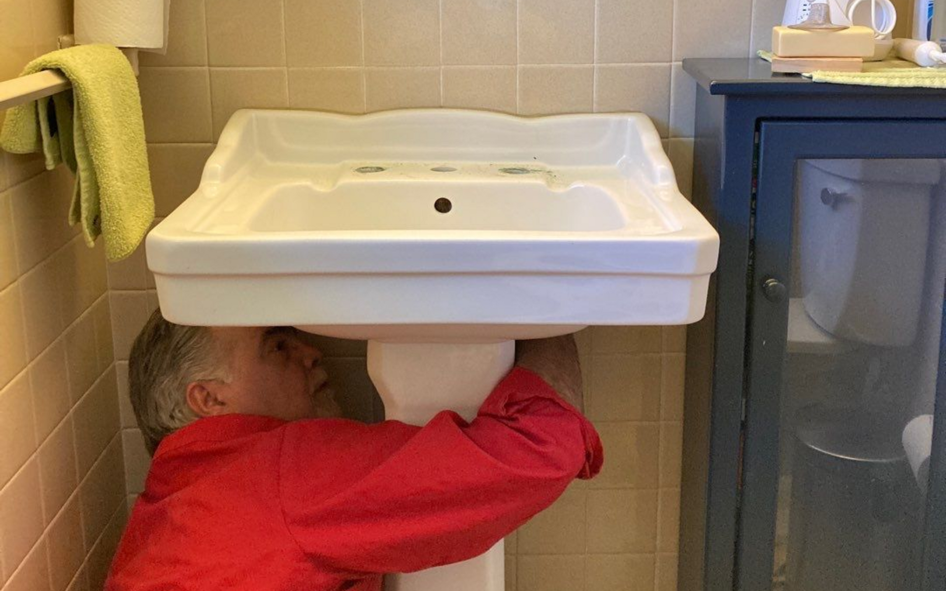 A male plumber from Advantage Plumbing, Inc. is lying on the floor providing plumbing services to a sink kitchen in Granger, IN. A male plumber from Advantage Plumbing, Inc. is lying on the floor providing plumbing services to a sink kitchen in Granger, IN.