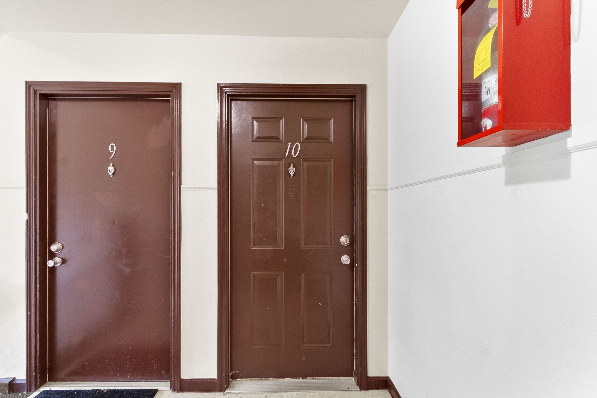 Two brown doors, one labeled