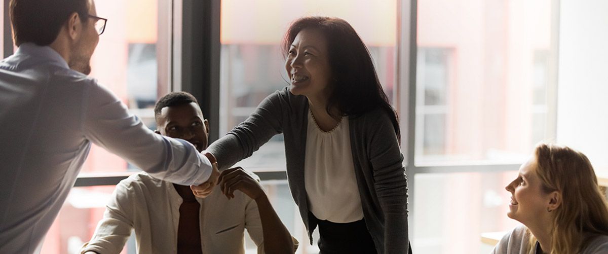 People shaking hands in an office