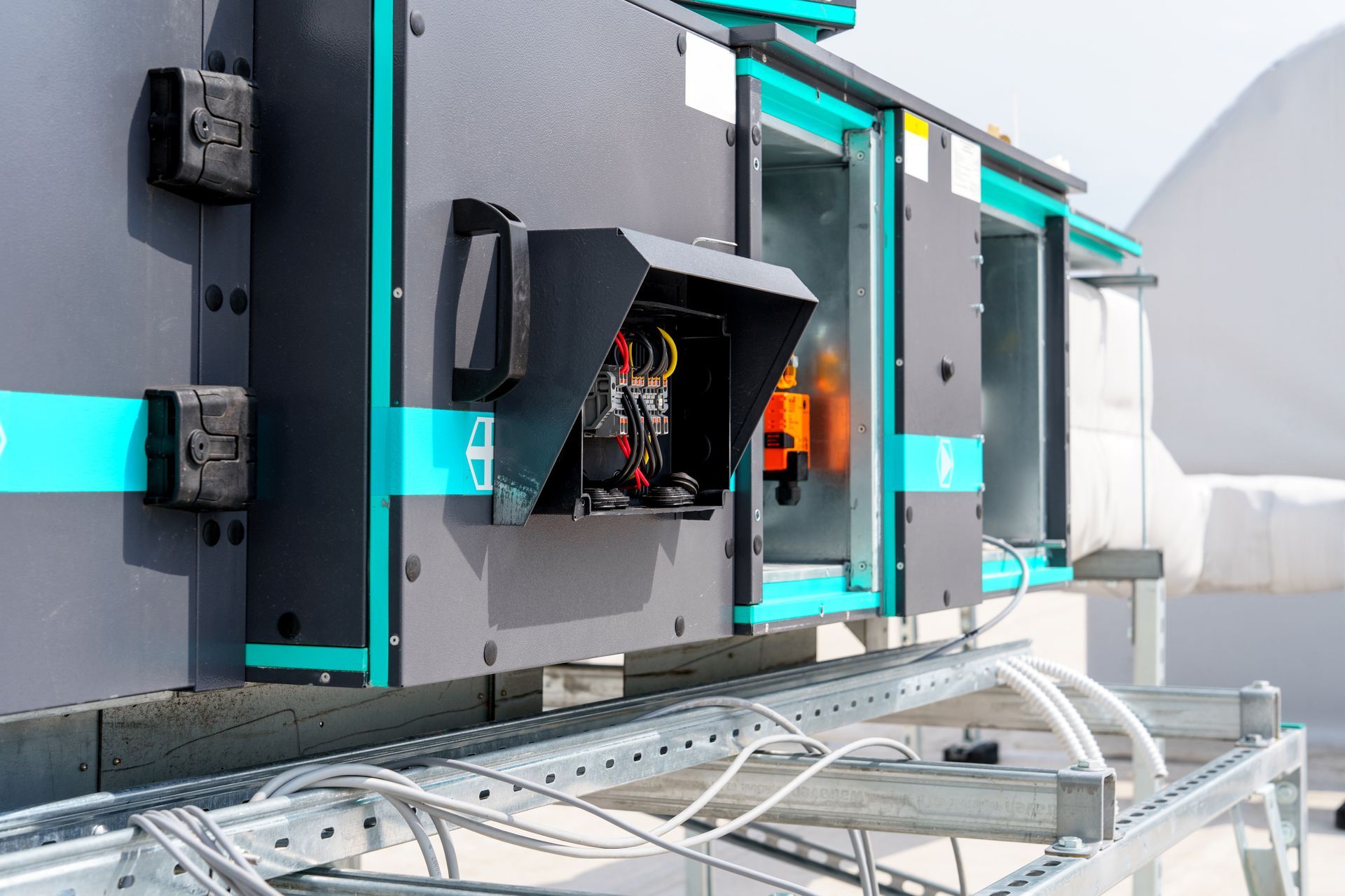 A close up of a ventilation system on top of a building.