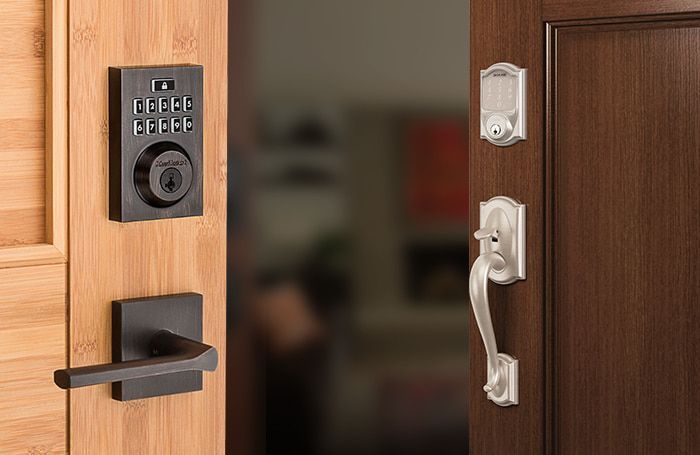 A close up of a door with a smart lock on it.